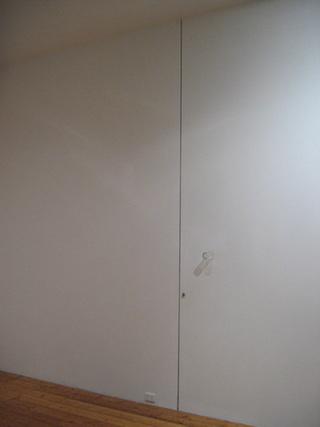 Mirror  2005					
Floor to ceiling incision in plasterboard wall, glass, lock, red pen, dimensions variable
