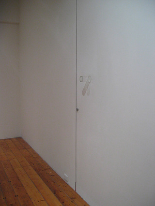 Mirror, 2005					
Floor to ceiling incision in plasterboard wall, glass, lock, red pen, dimensions variable