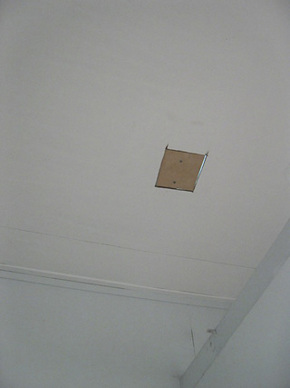 Site of Private Collection, 2006 
Repairing removed section of ceiling from the artist studio toilets at Gertrude Contemporary, Melbourne.
Dimensions variable