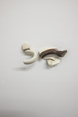 Coordinates that Locate a point on a line, exhibition detail  2022

family portrait  2019                                                          
found remains of ceramic handles collected from the banks of the Thames river in London, embedded into
plasterboard 17 x 9.5 cm